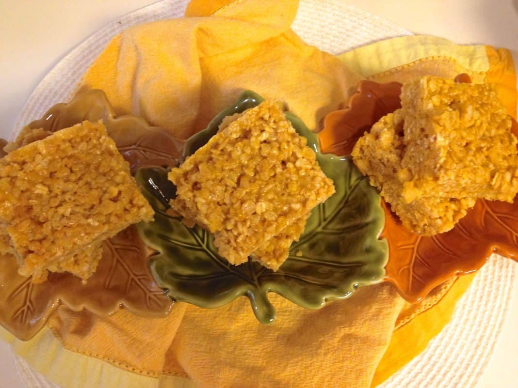 Pumpkin Spice Rice Krispies Treats via zagleft - 3 An overhead view of Six Pumpkin Spice Rice Krispies Treats in a leaf-shaped serving bowl