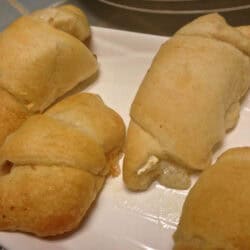 Four Brie and Pear Stuffed Crescent Rolls on a plate