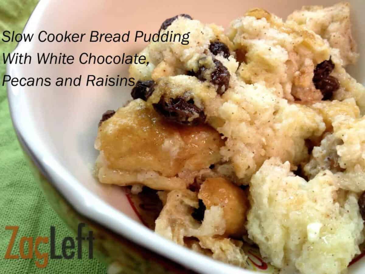 (a) Slow Cooker Bread Pudding With White Chocolate, Pecans and Raisins from @Zagleft A closeup of a bowl of Slow Cooker Bread Pudding with white chocolate, pecans, and raisins