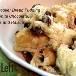 A closeup of a bowl of Slow Cooker Bread Pudding with white chocolate, pecans, and raisins