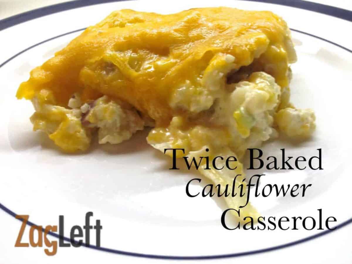 Twice Baked Cauliflower topped with a layer of melted cheese on a plate