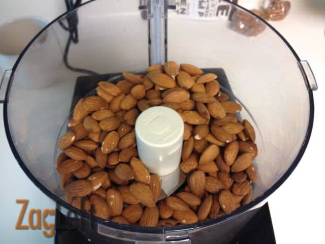 Raw almonds in a food processor
