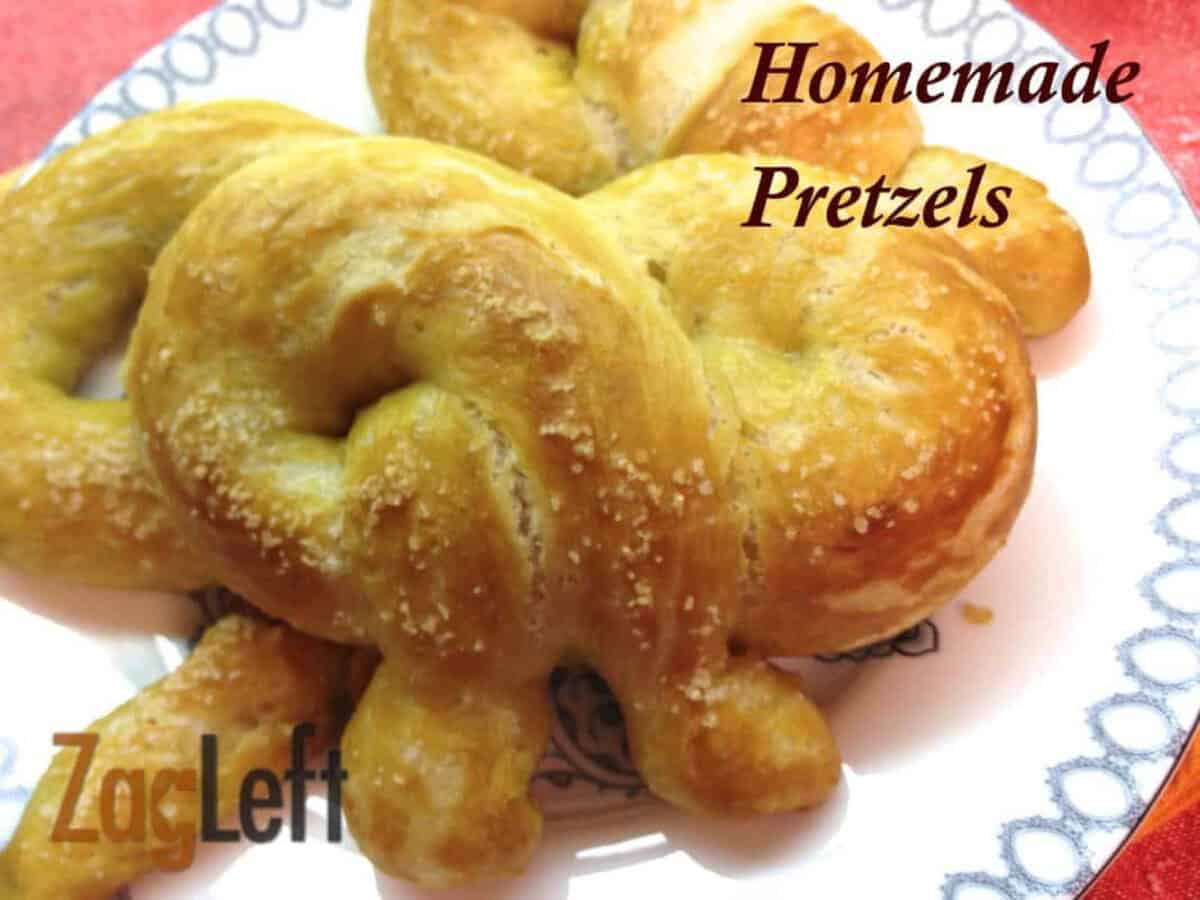 Three Homemade Pretzels topped with salt on a plate