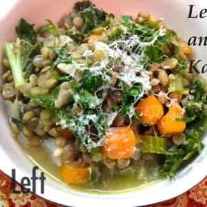 A closeup of a bowl of Lentil and Kale Stew topped with grated parmesan