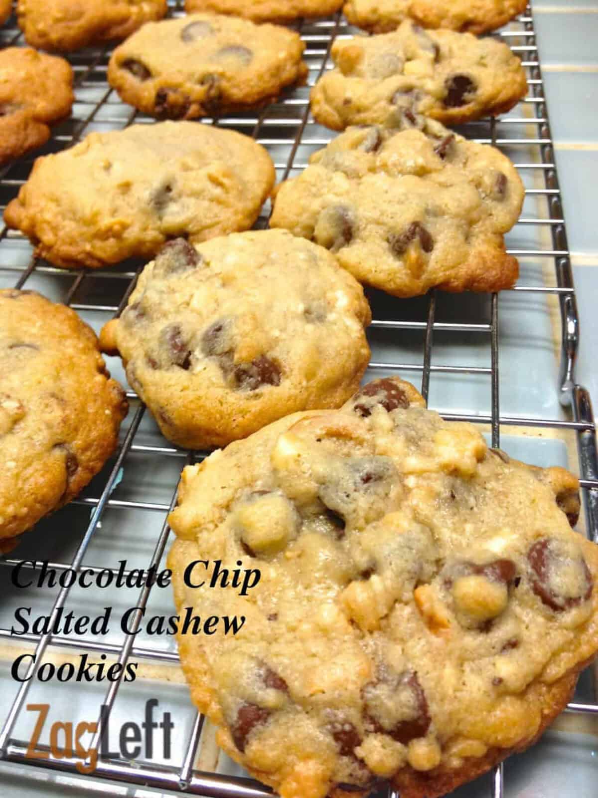 Eleven chocolate chip salted cashew cookies on a cooling rack