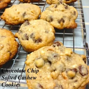 Eleven chocolate chip salted cashew cookies on a cooling rack