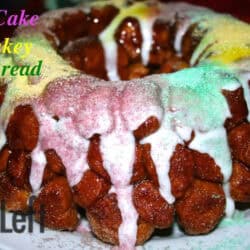 King Cake Monkey Bread coated with cinnamon sugar and topped with white icing and green, yellow, and purple sanding sugar on a plate