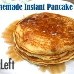 A stack of three pancakes topped with syrup on a plate