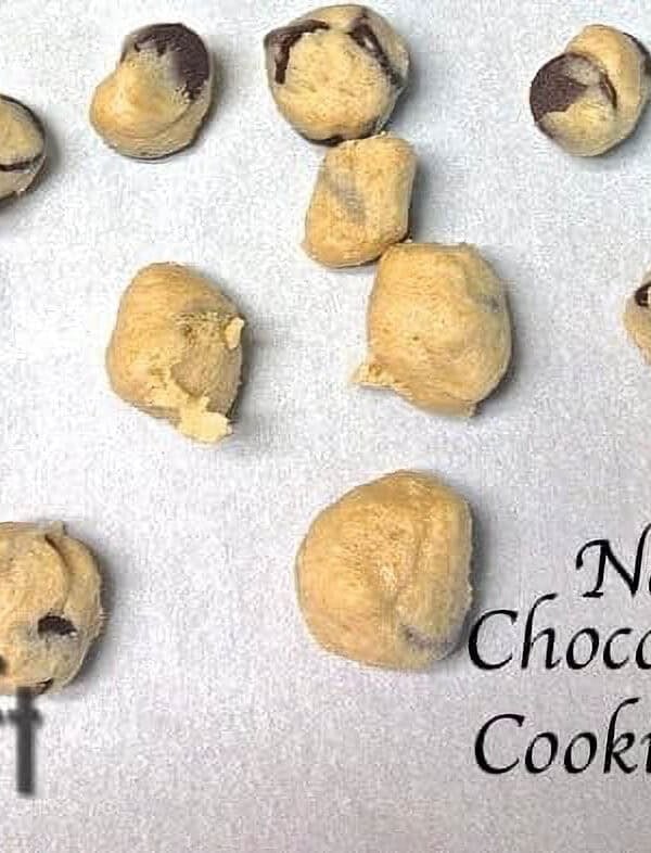 Overhead view of Seventeen No Bake Chocolate Chip Cookie Dough Balls on parchment paper