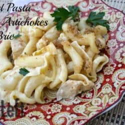 Baked Pasta with Artichokes and Brie topped with breadcrumbs on a plate