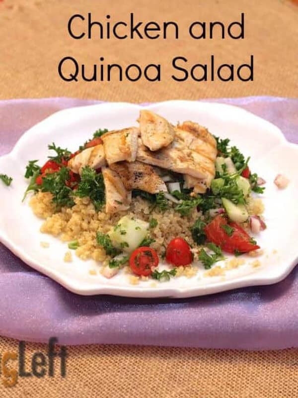 A plate of Chicken and Quinoa Salad with chopped cucumbers and cherry tomatoes