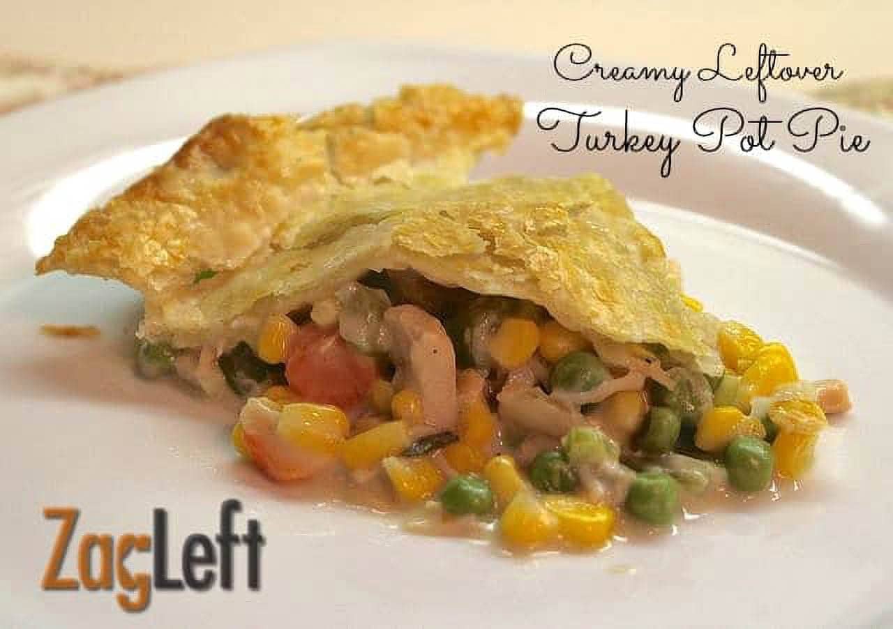 A slice of Creamy leftover Turkey Pot Pie on a plate