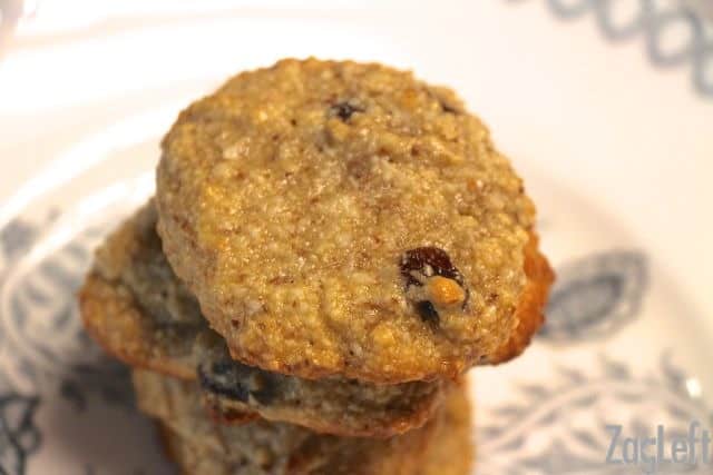 An overhead view of a stack of four Gluten Free Coconut Cashew Cookies on a plate