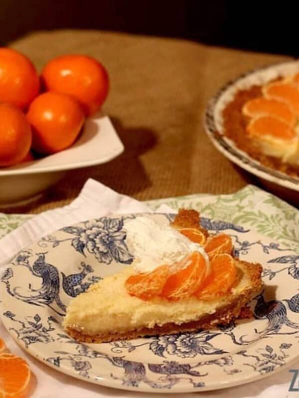 Five photos showing the Cutie Pie process and a big yellow flower- clementines, clementines being peeled, clementines being juiced, and the cutie pie on a plate topped with clementine slices and whipped cream