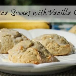 Three Banana Scones topped with Vanilla Glaze on a large plate