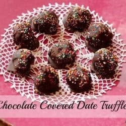 Overhead view of Nine Chocolate Covered Date Truffles topped with rainbow sprinkles in a circle on a doily
