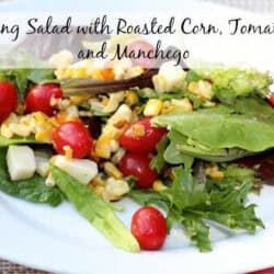 Spring Salad with Roasted Corn, cherry Tomatoes and Manchego on a plate