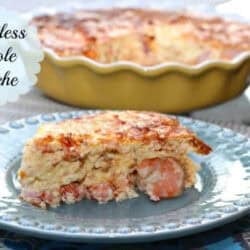 A slice of Crustless Creole Quiche on a plate with the remainder of the quiche in a pie dish in the background