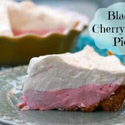 A slice of Black Cherry Jello Pie on a small plate with the remainder of the pie in a pie dish in the background