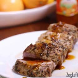 Citrus Glazed Pork Tenderloin cut into pieces on a large plate