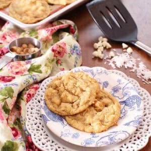 Soft chocolate chip cookies on a decorative plate, perfect for food lovers and travel food enthusiasts.