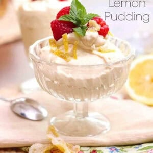 Dairy-Free Instant Lemon Pudding in a glass dessert glass topped with lemon zest, dairy-free whipped cream, raspberries, and mint